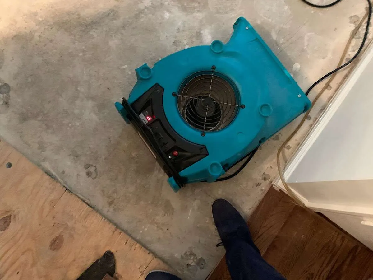 Air mover drying subfloor during Commercial Water Damage Restoration in Wabash
